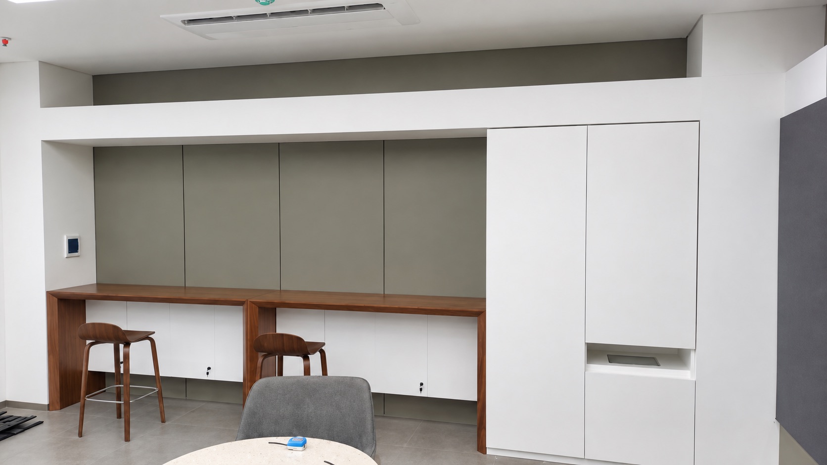 Bank interior reference showing cabinetry, seating and a counter.